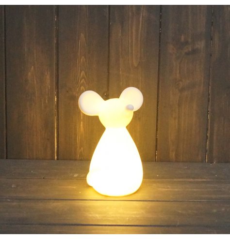 A simple ceramic mouse figure with a warm glowing LED centre 