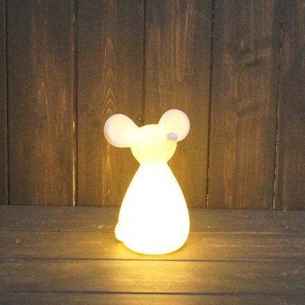 A simple ceramic mouse figure with a warm glowing LED centre 
