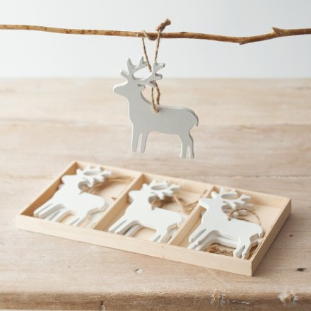 A Sleek and simple set of wooden reindeer cut decorations with jute string for hanging 