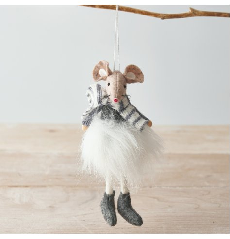 A adorable hanging fabric mouse with beige and grey tones and a fluffy tutu to complete her look 