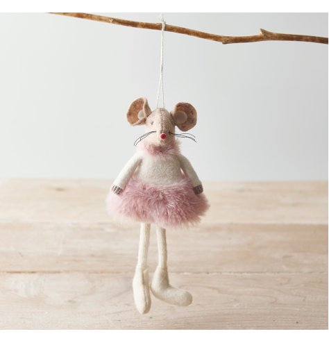 A adorable hanging fabric mouse with beige tones and a fluffy pink dress to complete her look 