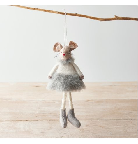 A adorable hanging fabric mouse with beige tones and a fluffy grey dress to complete her look 