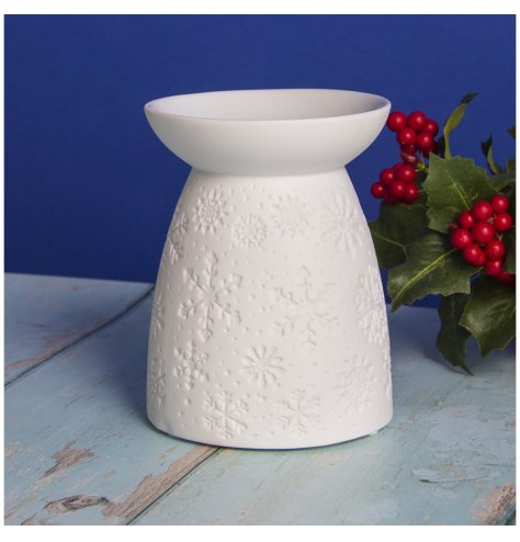 A gorgeous ceramic based tlight holder featuring an embossed decal and simple white toning  