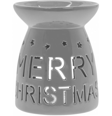 A simple grey toned ceramic oil burner, decorated with a cut out Merry Christmas text and star decal 