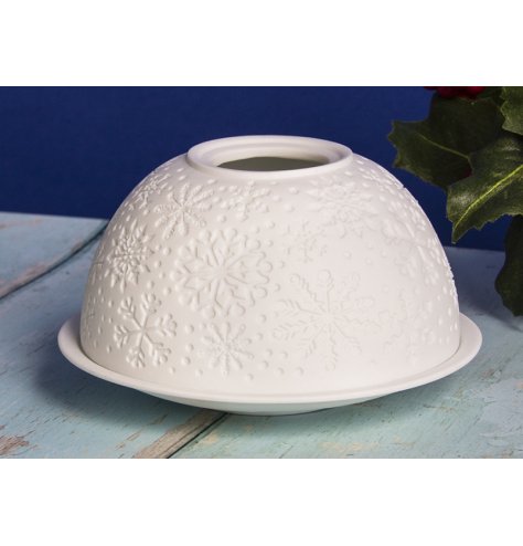 A ceramic based dome and plate tlight holder, displaying a beautiful embossed snowflake decal and white tone 