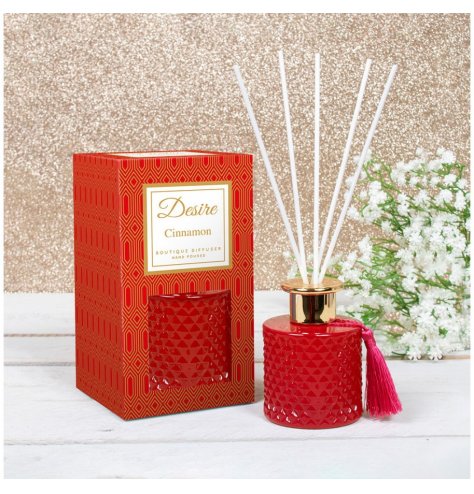 A festive scented Reed diffuser presented in a Gatsby inspired gift box, detailed with Red tones and a tassel to finish 