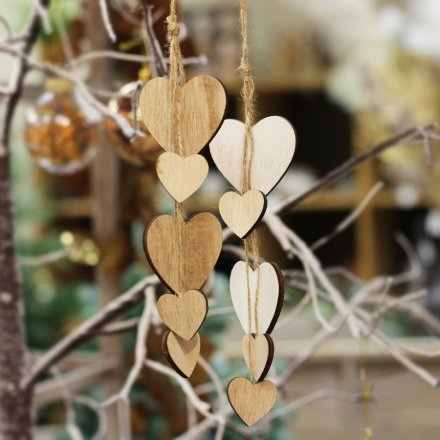 A mix of string hanging heart clusters in an assortment of natural and white wood tones 