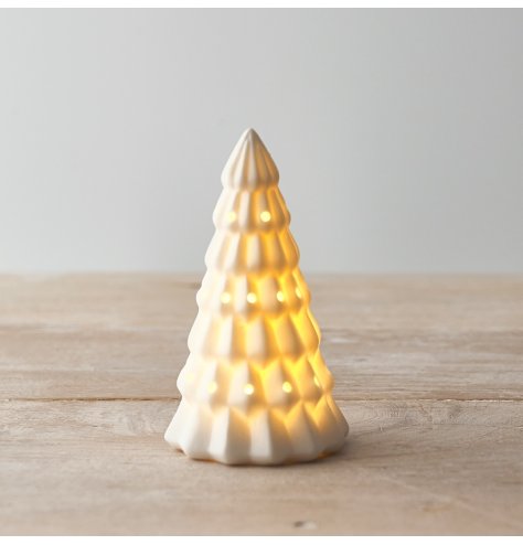 A ceramic white toned tree with a warm glowing LED central feature 