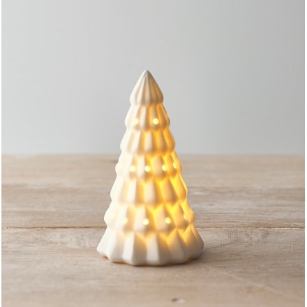 A ceramic white toned tree with a warm glowing LED central feature 
