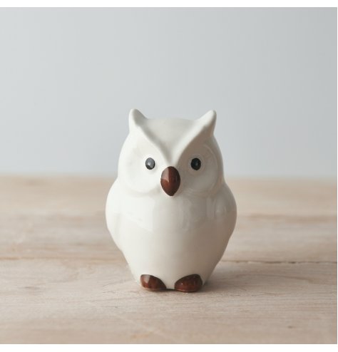 A ceramic based owl set with simplistic features minimal detailing 