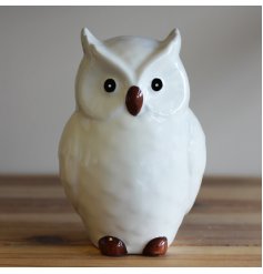 A sweet and simple posed perched ceramic owl named Oscar. 