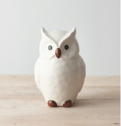 A sweet and simple posed perched ceramic owl named Oscar. 