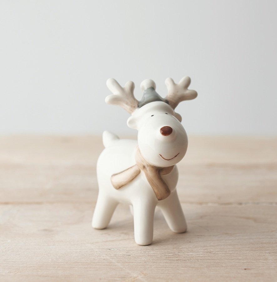 A sweet and simple posed ceramic reindeer set with grey and beige tones and a festive red nose! 