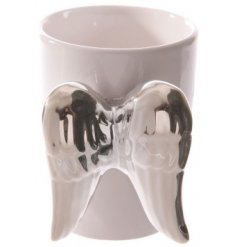 A sleek and simple white toned ceramic mug featuring an angel wing shaped handle in a silver hue 