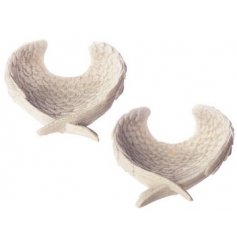 A sleek angel wing shaped bowl with added detail and a simplistic charm 