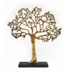 A sleek gold and black toned ornamental tree set upon a natural wood block base 