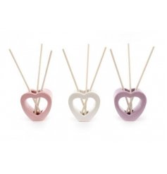 An assortment of pink, white and purple toned ceramic heart diffusers complete with scented sticks for each 
