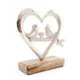 a wooden block based ornament with a heart decal 