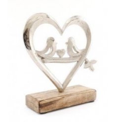 a wooden block based ornament with a heart decal 
