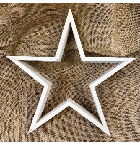 A natural wooden based star complete with a rough finish and white washed tone 