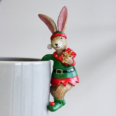 With his festive attire and added little present accent, this quirky pot hanging bunny is a must have for the Christmas