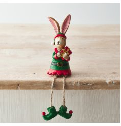 A festive little shelf sitting bunny dressed as an elf 