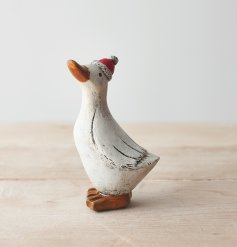  A posed little duck figure with a red festive hat to complete his simple look 