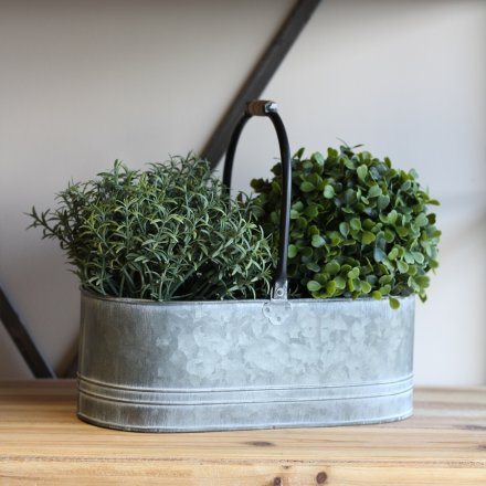  An aged looking metal planter featuring a washed look and central handles for feature 