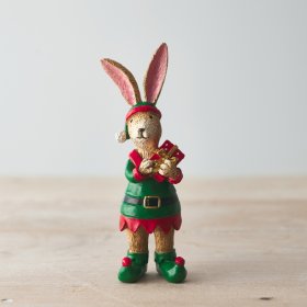 A small resin bunny figure dressed up as an elf 