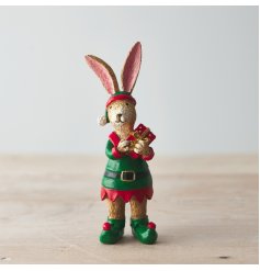 A small resin bunny figure dressed up as an elf 