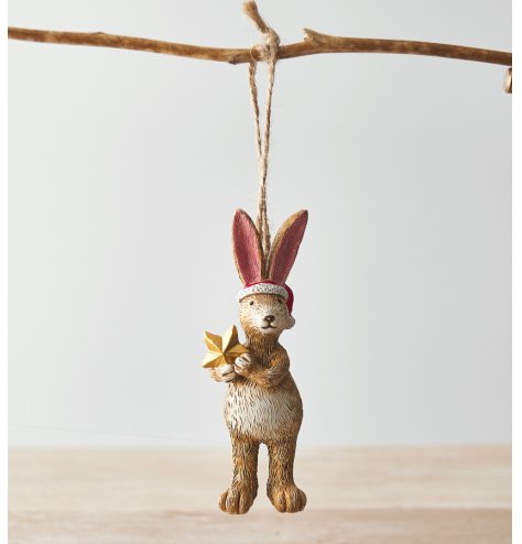 A unique, cute and wonderfully detailed hanging rabbit decoration. Complete with Santa hat and star.