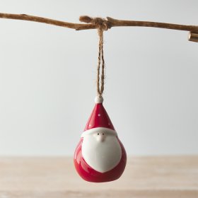 A small and plump little hanging Santa gonk with a polka dot hat and simple complexion 