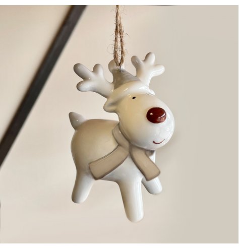 A small hanging ceramic reindeer decoration set with a simple red nose decal 