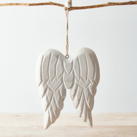  A chunky pair of wooden angel wings hung from a jute string, complete with an overly distressed finish and white wash t