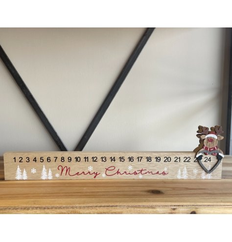 A unique wooden advent calendar with a sliding reindeer figure. Ideal for easy display on sideboards, dressers and the m