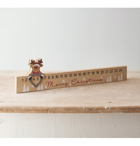 A unique wooden advent calendar with a sliding reindeer figure. Ideal for easy display on sideboards, dressers and the m