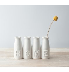 Chic and stylish accents to bring to any shelf side or window sill in the home, a set of 4 bottles with embossed text to