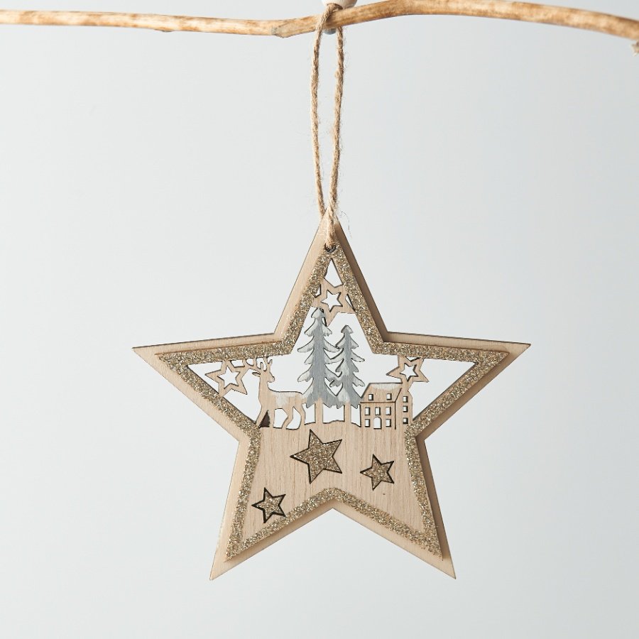 A charming simple rustic wooden star hanging decoration with a glitter trim and woodland scene cut out 