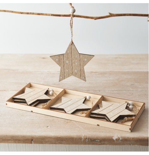 A set of wooden star hangers with a starry print and added jute string for hanging 