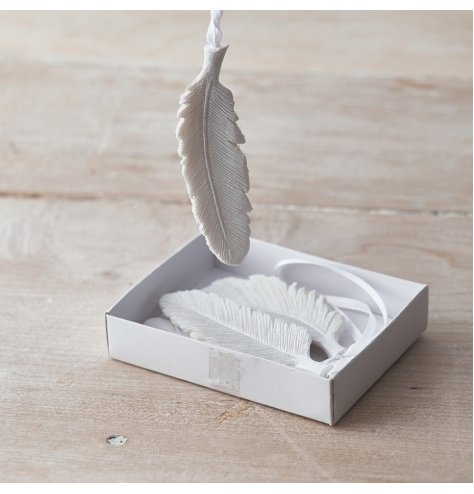 A set of 4 chic hanging feather decorations with a white glitter finish and organza ribbon hanger.