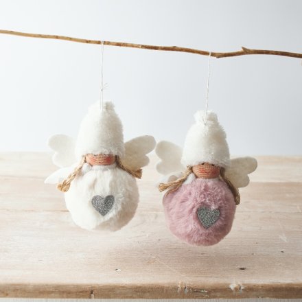 A fun and festive mix of hanging faux fur bodied angels with blush pink and white tones 