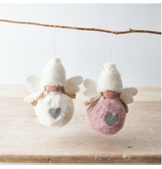 A fun and festive mix of hanging faux fur bodied angels with blush pink and white tones 