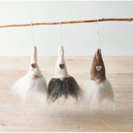 An assortment of hanging felt gonks with added heart decals and faux fur bearded trims 