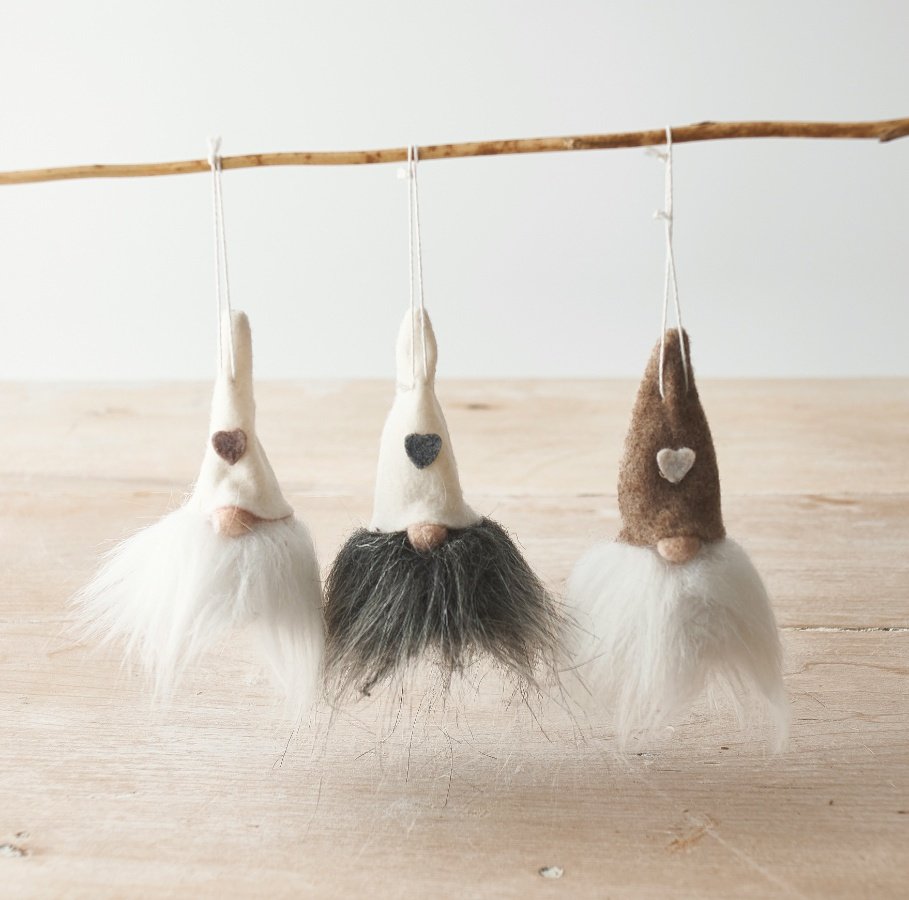 A festive mix of neutral toned felt gonks with jingling bells and faux fur bearded trims 