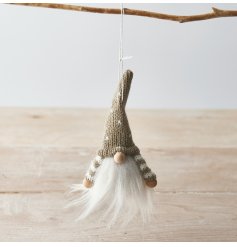   A sweet little plush gonk hanging figure with faux fur trims, a knitted hat and wooden features