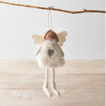  Sure to add an angelic hint to your tree display at Christmas, a faux fur bodied fabric angel with grey and white tone
