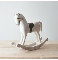  Perfect for bringing a Rustic Charm to any home space, a white toned wooden rocking horse with distressed features