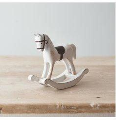 Perfect for bringing a Rustic Charm to any home space, a white toned wooden rocking horse with distressed features