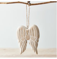  A chunky pair of wooden angel wings hung from a jute string, complete with an overly distressed finish and natural tone