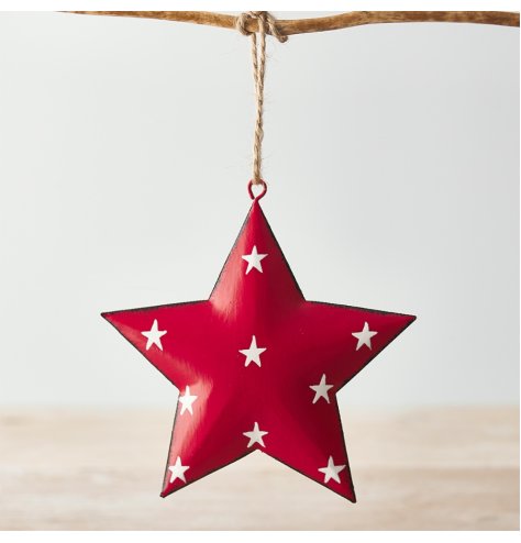 A hanging metal star covered with a soft red tone, distressed edge finish and added white starry print 